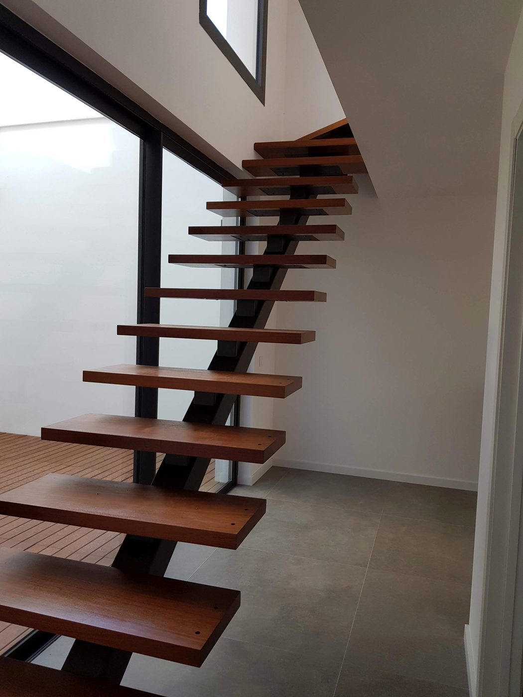 Finished wood and steel staircase after the Casa Llucmajor build, an installation by JSL in Mallorca