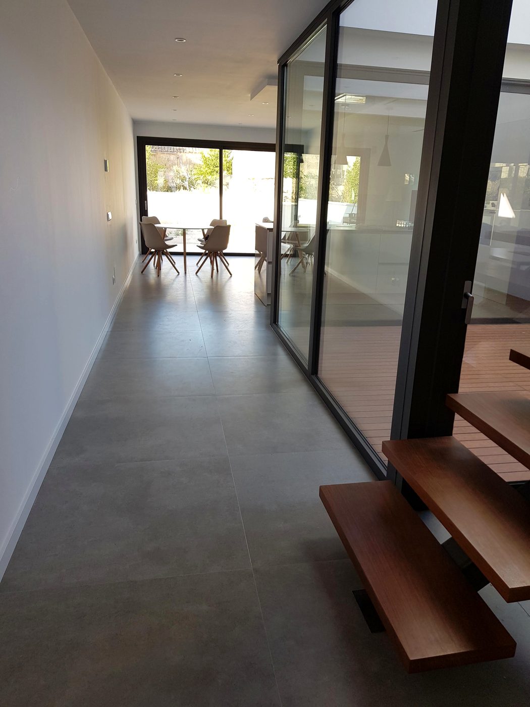 Finished double-height living room after the Casa Llucmajor build, an installation by JSL in Mallorca