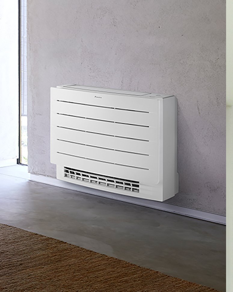 Unidad de suelo Daikin Perfera junto a una pared. Imagen oficial del fabricante (Daikin); no es una instalación de JSL.