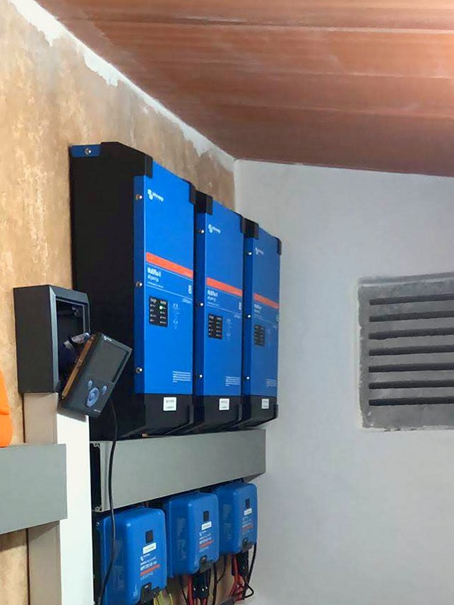 Victron MultiPlus inverter-chargers and charge controllers mounted on the wall, one of our installations in Mallorca