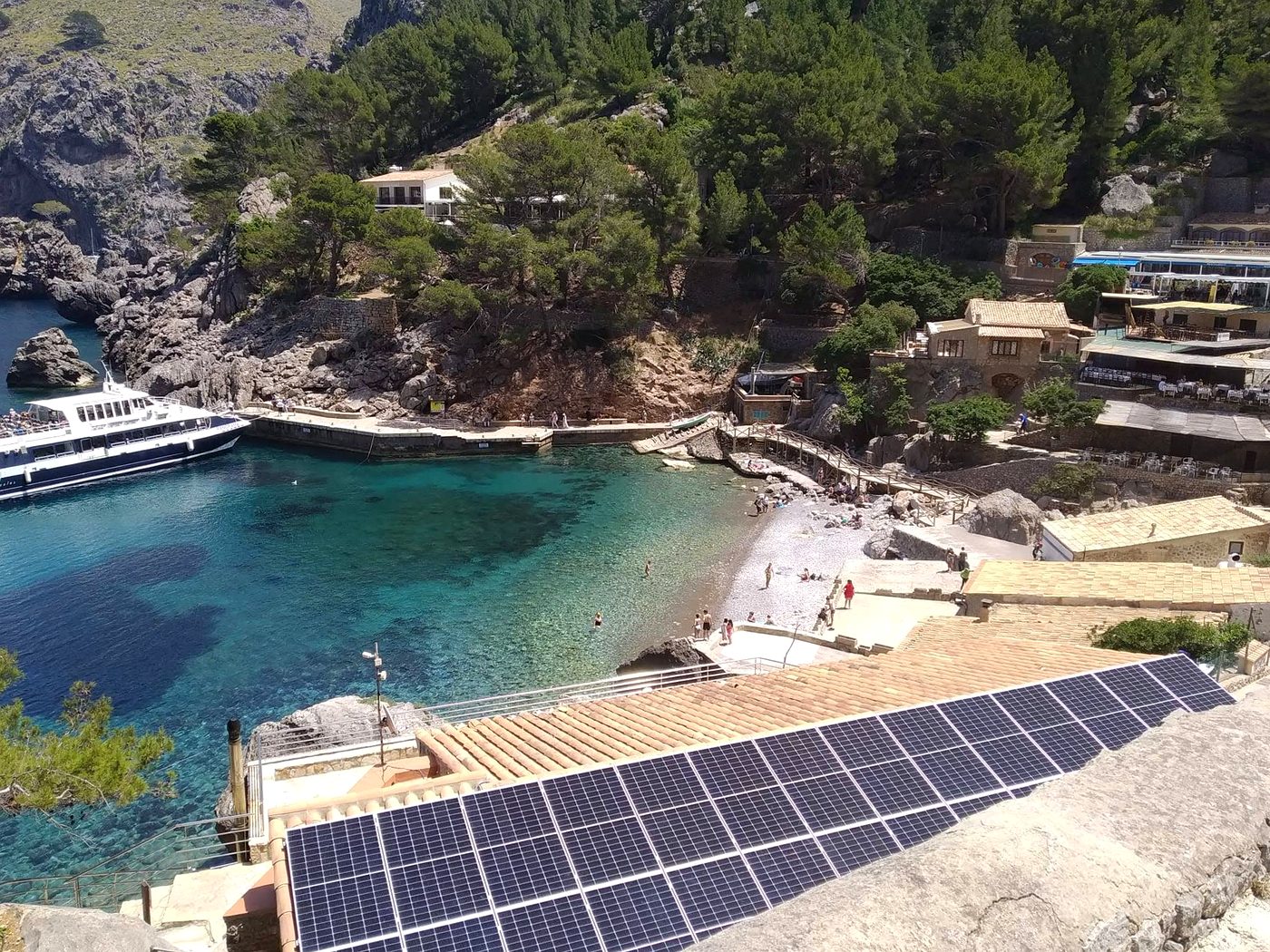 Solar panel installation with Sa Calobra cove in the background, Mallorca, by JSL